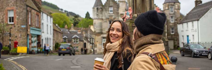 Two young women taking a walk through the town of Falkland