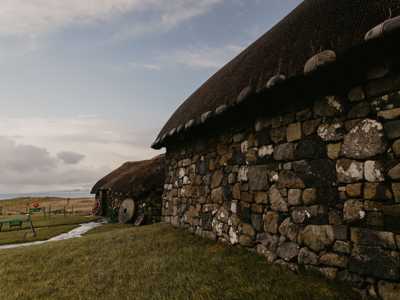 The Museum of Island Life on the Isle of Skye, a thatched-roof cottage surrounded by scenic landscapes