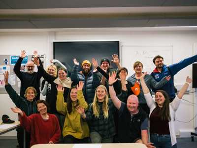 Group of travellers and Lecturer gatherered for group photo after Gaelic Language Tutoring Session