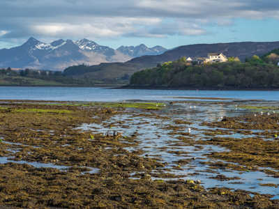 View of the Quiraing mountain range from Portree Harbour on the Isle of Skye
